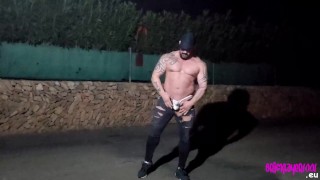 Thonged muscle man on a public street