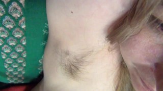 Blonde hairy armpit hair showing in armchair