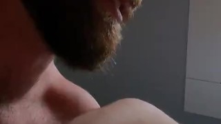 Two Bearded and Hairy Men Kissing