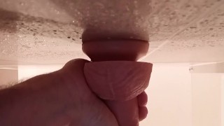 Masked guy sucks dildo
