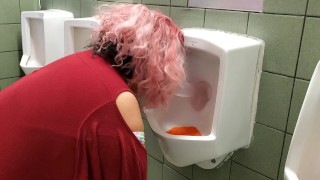 Sucking a dildo inside a Public Urinal!