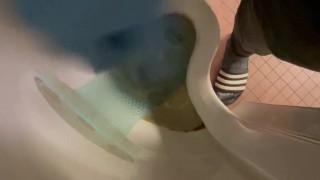 Wanking in urinal with blue nitrile gloves