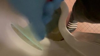 Wanking in urinal with blue nitrile gloves