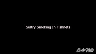 Sultry Smoking Blonde MILF In Fishnets Bra and Panties - Nikki Ashton