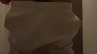 Cheeky guy jerks off a hairy dick in a toilet in sweatpants