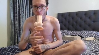 Opening up new 9 inch fat dildo and deepthroating it