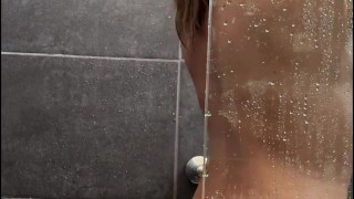 Beautiful milf soaps her sexy body and takes a hot shower after sex