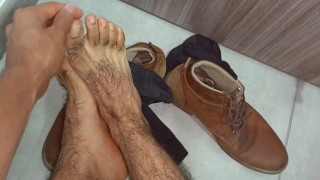 Male feet. Contemplating this lumberjack feet and hairy legs. Lick it or smell it?