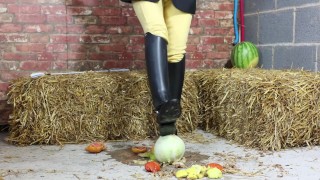 Equestrian Louisa crushing fruit wearing boots
