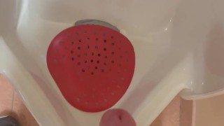 Jerking off into public urinal