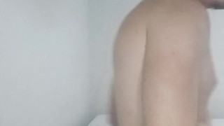 Handsome guy folding laundry naked