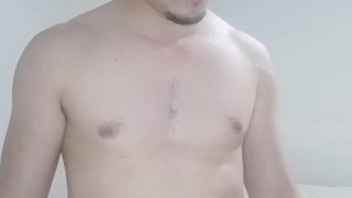 Handsome guy folding laundry naked