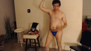 He is Posing in a Sparkly Blue Bikini Brief for Money!