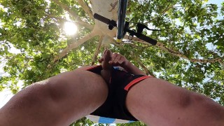 Bulging young man moans with pleasure in a public park jerking off a summer handjob