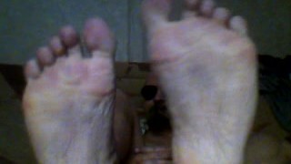 Muscle bear shows his big bear feet and wants them licked, sucked and worshipped