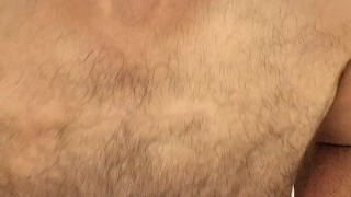 Hairy muscle bear flexing in black boxers