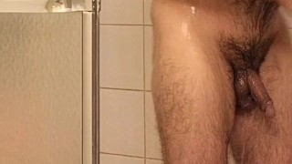 Hairy muscle bear flexing in the shower
