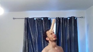 Skinny horny man attaches his big dildo onto his forehead and plays around with his cock