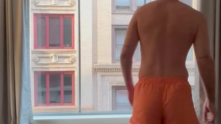 Hotel window in boxers