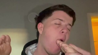 Young licking boyfriend’s feet