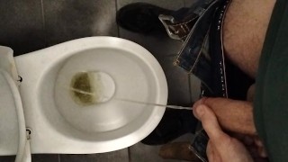 pissing in a public toilet