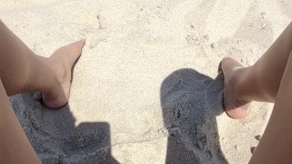 squirting at the nude beach while people walk by