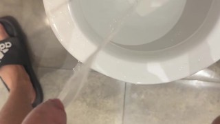 pissing hard at public wc