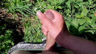 I went out to jerk off in a field by the road.Beautiful cum with a good dick