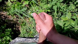 I went out to jerk off in a field by the road.Beautiful cum with a good dick
