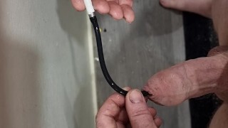 White kiw nz bear inserts a urethra tube in his cock to his bladder and "water" comes out,