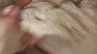 Bearded hairy man cumming on his own chest