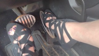 Big feet pedal pumping the gas pedal in strappy sexy black heels