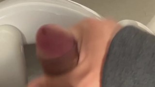 I jerk off in a public bathroom while someone pisses in the stall next to me