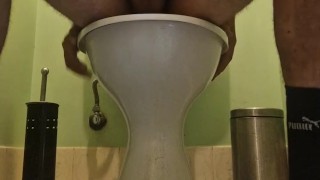 Riding dildo on the toilet