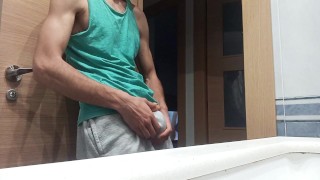 Slim Guy in a Tank Top Shows How He Cums with His Huge Shaved Cock