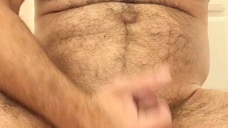 Hairy muscle bear shows off armpits and plays with nipples