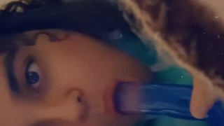 Sucking on a dildo