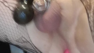 Caged sissy plays with her toys