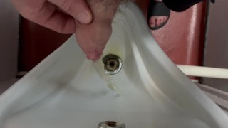 Peeing in a urinal on a hot summer’s night