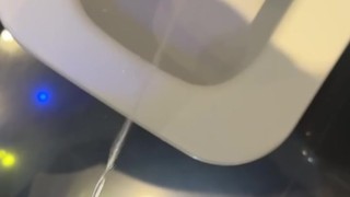 pissing with big hard at the bathroom