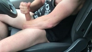 Muscular gay trucker wearing gym vest with huge cock flexes and cums in his truck cab