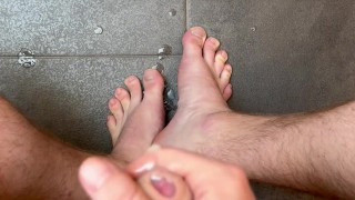 Horny soccer player jerks uncut dick and cums on toes