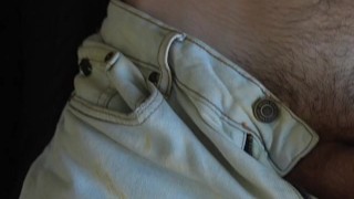 a handsome guy with blue eyes with a big dick jerks off in front of the window