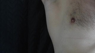 a handsome guy with blue eyes with a big dick jerks off in front of the window