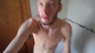 Super skinny male shows off his body while showering