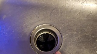 Messy piss into the kitchen sink