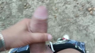 Jerk off near lake, close up looks on big glans and cum to lake