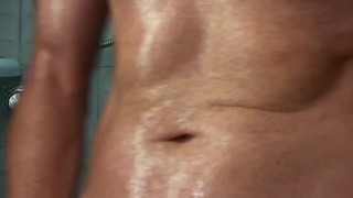 Muscular DILF jerks off in the shower on a hot day