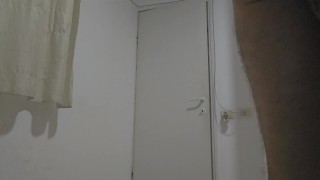 A bisexual man plays with the toys in the grass outside the house