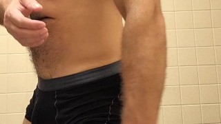 Hairy muscle bear flexing and posing after gym workout